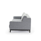 Sofá cama gris Kanna de Hanabi Living, vista lateral con cojines y estructura moderna en sala de estar.